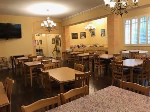 an empty dining room with tables and chairs at Mayflower Hotel in San Francisco