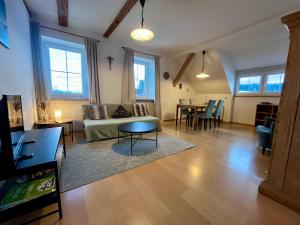 a living room with a couch and a table at Ferienhof Weber Nieratz in Wangen im Allgäu