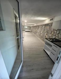 a room with a hallway with a stone wall at Il Bunker in Bolano +18 photos