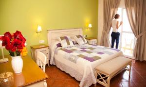 Posteľ alebo postele v izbe v ubytovaní Hostal Los Pinos