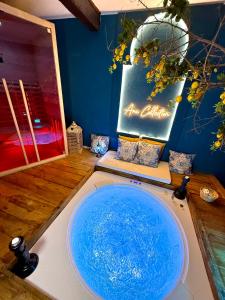 a bathroom with a large blue sink in a room at Ama Collection Esclusive Spa Ariosto in Ferrara +25 photos