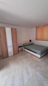 a bedroom with two beds in a room at Coco 2 free parking in Pržno