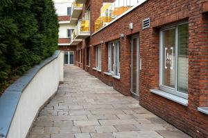 a brick alleyway between two buildings at Industrial Apartment ZERO in Bratislava