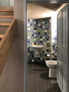 a bathroom with a sink and a toilet at Dar el Maasser دار المعاصر in Maasser El Chouf +4 photos