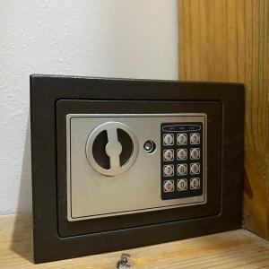a small black and silver microwave with a dial at Fish House in Nungwi