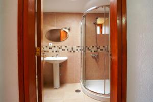 a bathroom with a shower and a sink at Apartamentos Panamá in Puerto Rico de Gran Canaria