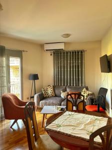 a living room with a couch and a table at L&K Old Town Apartment in Podgorica
