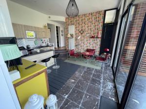 a kitchen with a table and chairs in a room at Villa Julie in Biarritz