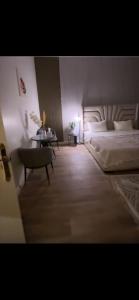 a bedroom with a bed and a table and a bed sidx sidx sidx at Ksa2 in Hail