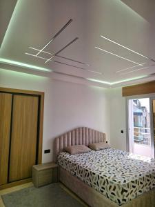 a bedroom with a bed in a room at panoramic sky 17 in Tangier