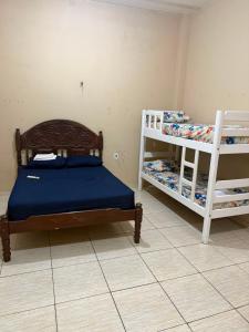 a bedroom with two bunk beds in a room at APT da Orla 305 in Santarém
