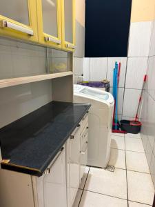 a small kitchen with a sink and a toilet at APT da Orla 305 in Santarém