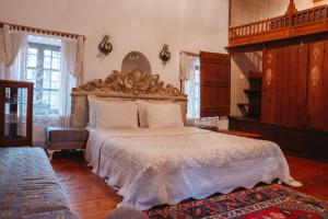 a bedroom with a large bed with a wooden headboard at Boleka Bodrum in Bodrum City