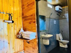a bathroom with a shower and a toilet and a sink at Peaceful Happiness Bungalow with Valley Views in Sapa