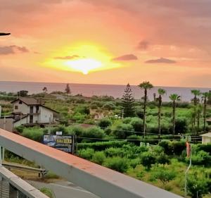 a sunset from the balcony of a house at Suite Ekaterina Sunsets 2 minuti dal mare in Brolo