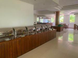 a waiting room with a row of mattresses at Nice Place Resort in Dambulla