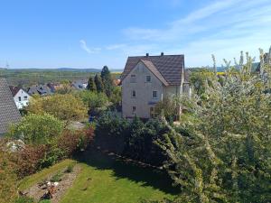 an aerial view of a house in a village at FeWo Waschbär in Waldeck