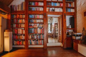 a room with several shelves filled with books at Boleka Bodrum in Bodrum City
