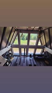 a view of a room with a large window at The Robian Chalet in Suceviţa