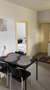 a black table and chairs in a room with a bed at Relaxing House in Lever
