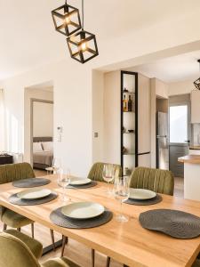 a dining room with a wooden table and chairs at Luxury Family Villa near beach in Lechaio