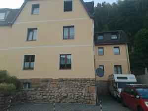 a house with a car parked in front of it at Lilienstein in Rathmannsdorf