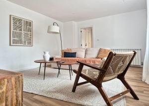 a living room with a couch and a table at YourHouse O Canton 3 in Lobios