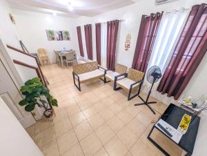 an overhead view of a living room with chairs and a table at Panglao 4 Bedroom Family and Group House With Pool in Dauis