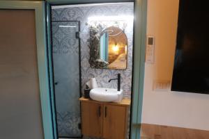 a bathroom with a sink and a mirror at Ayham dream house in Acre +26 photos