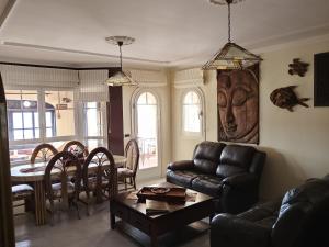 a living room with a couch and a table at Casa Chalet El Bucanero Morro Jable in Morro del Jable