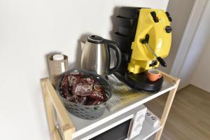 a counter with a coffee maker and a mixer on it at Casa Vacanze Andromeda in Agerola