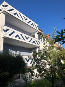 a white building with black and white accents at Eligo in Friedrichshafen