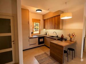 a kitchen with a sink and a counter top at Belvedere in Dobrota