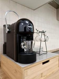 a blender sitting on a counter in a kitchen at Campesio Apartament in Piacenza