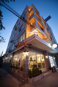 a store front of a building at night at Hoppers Place Donmuang in Bangkok