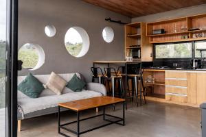 a living room with a couch and a table at Villa Toscana I - Gran Vista y Tranquilidad in Villa Serrana