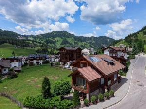 a house on a hill in a village at Noe Dolomite Residence in Badia