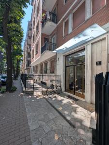 a bike parked in front of a building at Campesio Apartament in Piacenza