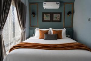 a bedroom with a large bed and a window at 3 BEDROOMS Premium Private Cottage In Murree Mountains in Murree