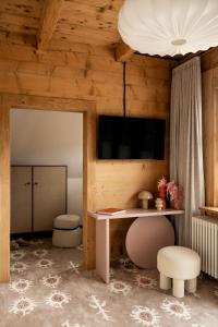 a room with a desk and a table and a stool at Owca na Polanie in Zakopane +19 photos