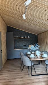 a dining room with a table and some chairs at Forest Solotvyno in Solotvyno