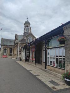 an old building with a clock tower on top of it at Number 28 with 1GB Fibre in Thetford