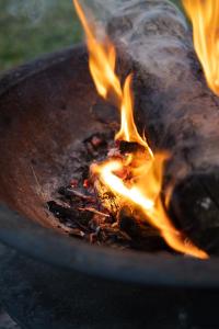 a close up of a fire in a grill at La cabane féerique in Ames