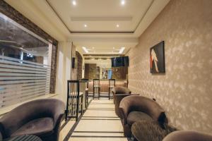 a row of leather chairs in a waiting room at Fantasia Hotel in Hurghada