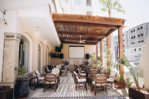 a group of chairs and tables on a patio at Fantasia Hotel in Hurghada