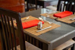 a table with a red napkin on top of it at Fantasia Hotel in Hurghada