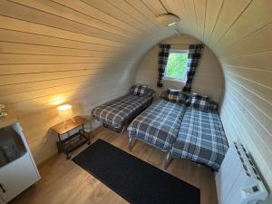 an overhead view of a bedroom in a tiny house at Pentland View Campsite in Haywood +67 photos
