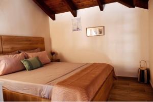 a bedroom with a large bed in a room at Kyma&Soul Seaview Loft in Xylokastro