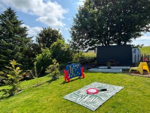a blanket sitting on the grass in a yard at Pentland View Campsite in Haywood