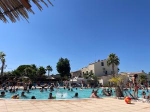 a group of people in a swimming pool at Mon nid douillet in Valras-Plage